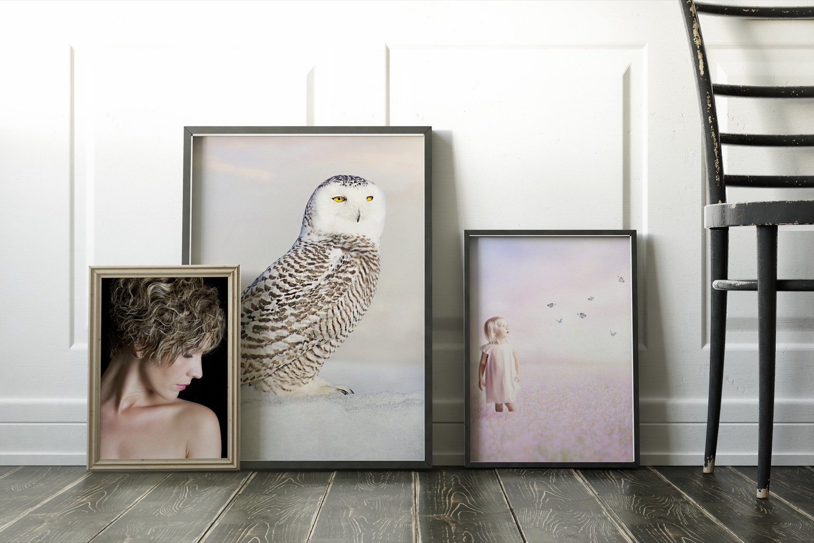 Three of Shauna Kenworthy&rsquo;s photographs, framed and leaning against a wall